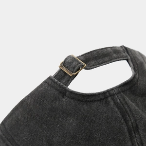 Detailed back view of charcoal gray washed cotton baseball cap with brass buckle