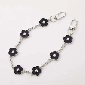Silver metal chain link strap with black enamel flower charms and lobster clasps