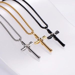 Wrapped cross pendant necklaces in silver, gold, and black stainless steel for couples