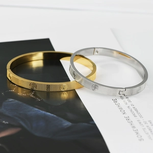 Detailed view of titanium steel bracelets with grid texture and classic embossed motifs