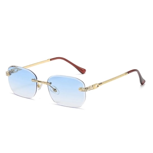 Frameless blue gradient sunglasses with gold metal diamond-studded spiral temples