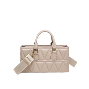 Elegant beige square handbag with geometric triangular quilting and wide crossbody strap