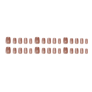 Translucent cat eye press-on nails in sweet reddish brown with a glossy square oval finish