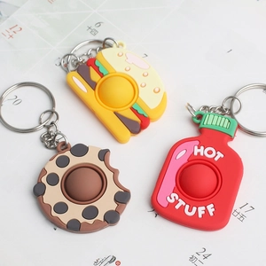 Fidget toy keychains set with hot sauce, cookie, and burger shapes in silicone