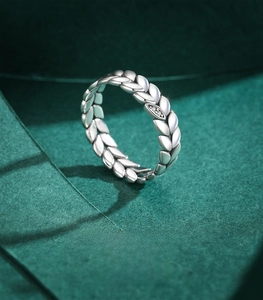 Detail of 925 sterling silver ring with leaf micro-pave cubic zirconia inlay