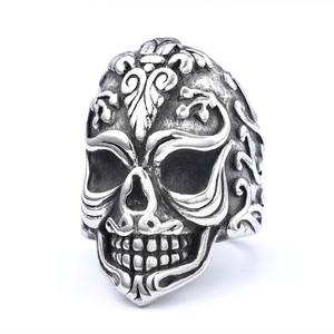 Vintage punk skull ring in stainless steel with intricate baroque floral carvings