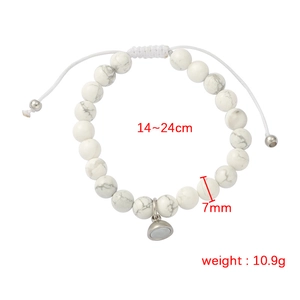 Detail showing 7mm white marble beads and adjustable 14-24cm strap for couple bracelet