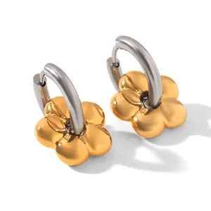 Close-up of dual-tone flower drop earrings in polished gold and silver stainless steel