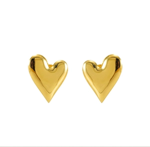 Macro detail of high-shine 18K gold-plated stainless steel 3D heart-shaped stud earrings