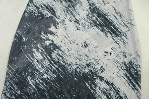 Detail shot of modern grey and black abstract ink print fabric with fine woven texture