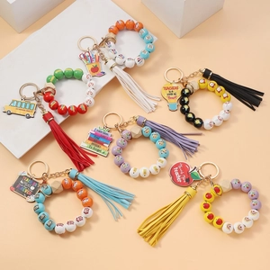 Detail of colorful silicone beaded keychain bracelets with teacher appreciation charms