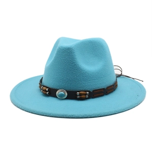 Detail of lake blue fedora hat with brown leather band and turquoise bead decor