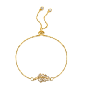 Macro detail of gold-plated leaf bracelet with zircon pave and adjustable slider buckle