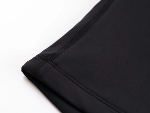 Detail of reinforced double-needle stitching on high-stretch black seamless fabric