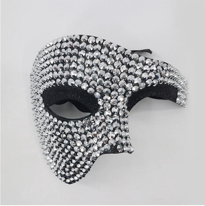 Detail of silver sparkling rhinestones on an elegant masquerade half-face mask for women