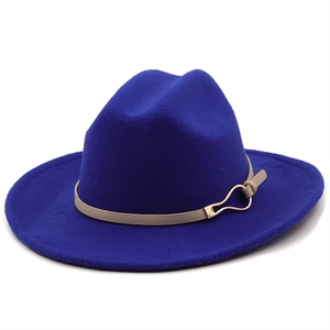 Detail of royal blue wool fedora hat with beige leather band and gold buckle