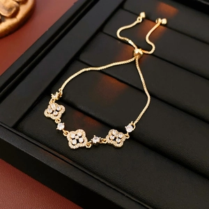 Detailed view of a gold-plated adjustable bracelet with sparkling zircon hollow flowers