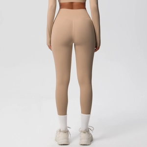 Close-up of seamless high-waisted yoga leggings showing peach lift and fabric texture