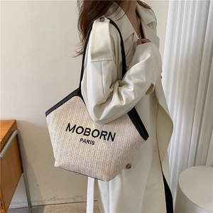 Retro straw woven bucket bag with black leather strap and MOBORN PARIS logo print