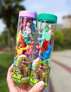 Close-up of colorful mini dinosaur toy models in transparent plastic tubes