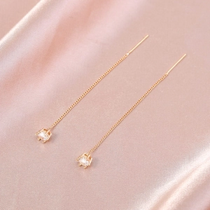 Sparkling zircon long tassel threader earrings in rose gold finish on silk fabric