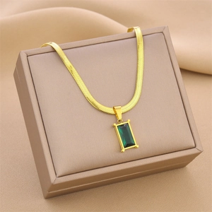 Luxurious titanium steel necklace with emerald-cut green pendant on gold snake chain