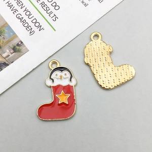 Detailed front and back view of cartoon penguin Christmas stocking enamel pendants