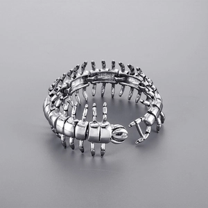 Detailed close-up of a stainless steel centipede bracelet with punk rock skeletal links