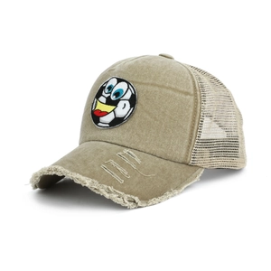 Detail of washed khaki denim baseball cap with frayed brim and smiley football patch