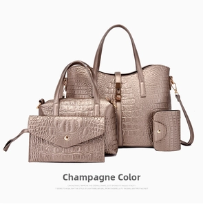 Detail of champagne crocodile embossed leather bag 4-piece set including large tote and clutch