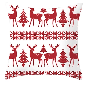 Christmas reindeer pillow cover with festive red elk and snowflake patterns on white linen