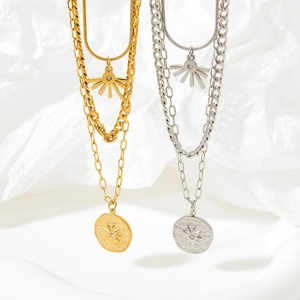 Three-layer stacked necklaces with geometric coin and sunburst pendants in gold and silver