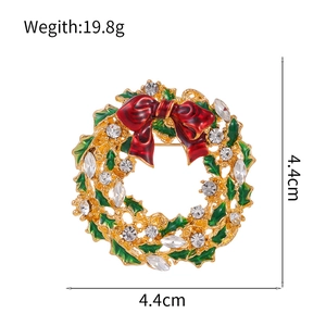 Christmas wreath brooch with green enamel leaves, red bow and crystal accents, 4.4cm size