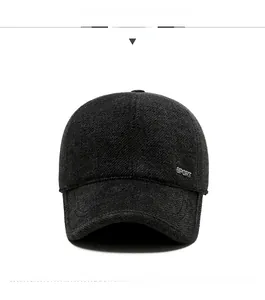 Close-up of dark grey wool blend baseball cap featuring a metal SPORT logo on the side