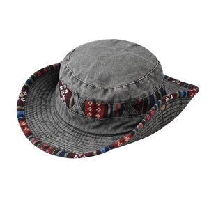 Detail of grey washed cotton outdoor sun hat featuring ethnic woven decorative bands