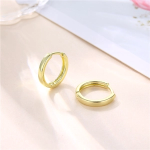 Minimalist 18k gold plated hoop earrings with smooth polished finish on soft background