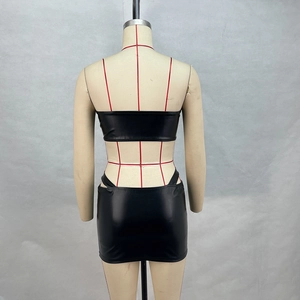 Rear view detail of black faux leather two-piece set with tube top and mini skirt