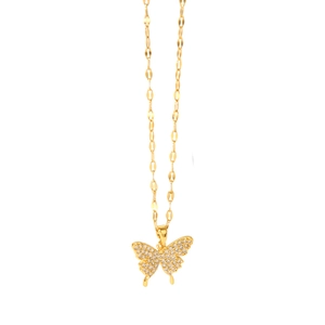 Macro detail of a 18k gold plated bowknot butterfly necklace with sparkling zircon wings