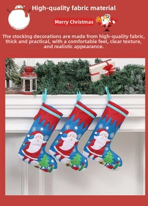 Detailed view of three blue Christmas stockings with Santa embroidery on a fireplace
