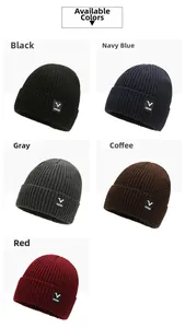 Detail showing knit beanie texture with V SPORTS patch in black, navy, grey, and red