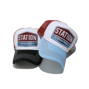 Retro embroidered mesh trucker hat with contrast colors and Station logo embroidery