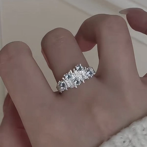 Irregular silver ring with shimmering zircon clusters in a modern minimalist style