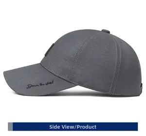 Side view of dark grey baseball cap showing 'Down the street' cursive embroidery detail
