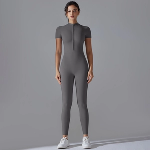 Close-up of dark grey high-stretch yoga jumpsuit with half-zipper stand collar detail