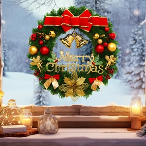 Christmas wreath with red gold balls and Merry Christmas sign on snowy window sill