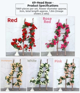 Artificial rose vine with 69 flowers shown hanging on stairs for wedding decor