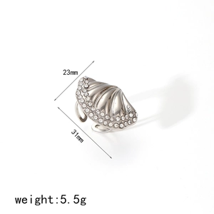 Silver shell ring with cubic zirconia rhinestones measuring 23mm by 31mm on white background