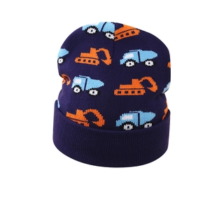 Winter knit beanie for toddler boys featuring blue truck and orange excavator patterns
