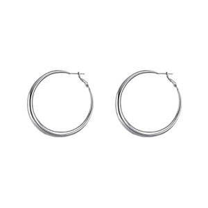 Minimalist silver hoop earrings with crescent thickness and high-polished finish