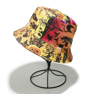 Detail of Halloween bucket hat featuring pumpkin ghost prints and Happy Halloween text
